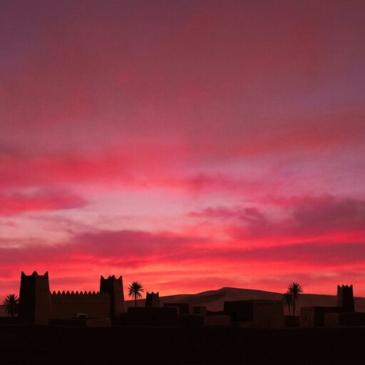 The same horizon at sunset, the sky rose and red.